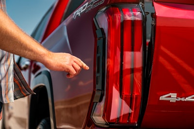 Press a button in the rear taillight and a lighter tailgate for the 2022 Tundra will drop down.