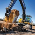 John Deere 350G LC SmartGrade Excavator scooping up a bucket of dirt