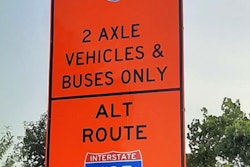 Orange sign with I-95 2 Axle vehicles & buses only on top and alt route I-495 on bottom