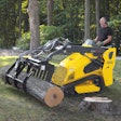 Wacker Neuson SM100 being used to pickup a log