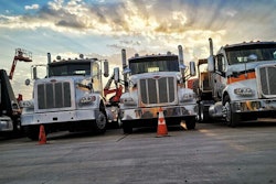 H&E Equipment Services trucks parked in a row
