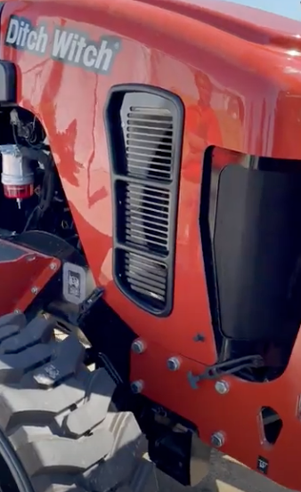 Ditch Witch's patented cooling fan simultaneously pulls air in from the front and off the rear, exhausting it out of both sides of the trencher.