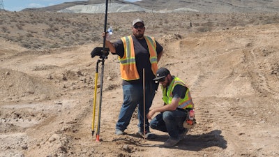 Heavy equipment operating students at a construction site.