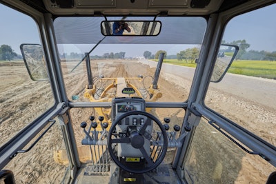 Cab of the Cat 120 GC motor grader.