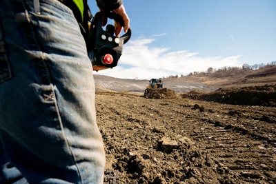 contractor using cats new remote command on dozer