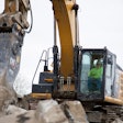 Cat excavator using P224 pulverizer attachment