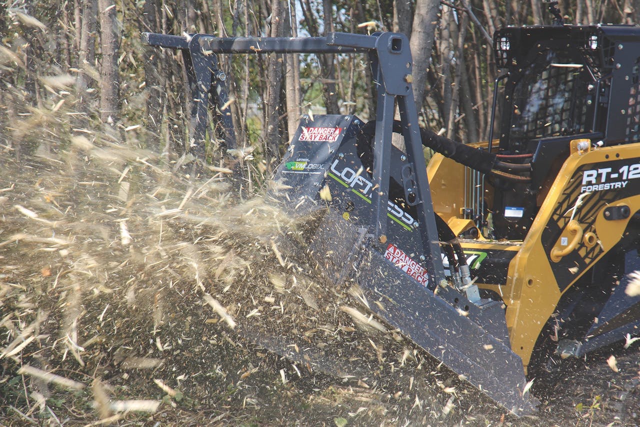 Loftness Bad Ax on compact track loader clearing land