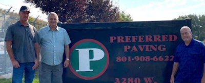 Ryan, Bill, and Curtis standing in front of Preferred Paving's sign
