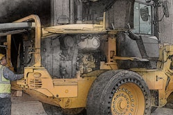 Worker servicing a piece of Cat equipment