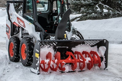 Bobcat Snowblower on skid steer clearing snow