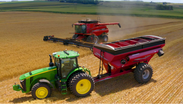 Combine with tractor and auger wagon