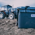 Blue Coolers' 55-quart ice vault cooler at a construction site.