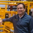 Jay Sugar next to Hy-Brid Lift scissor lift.