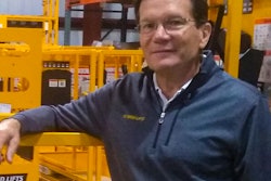 Jay Sugar next to Hy-Brid Lift scissor lift.