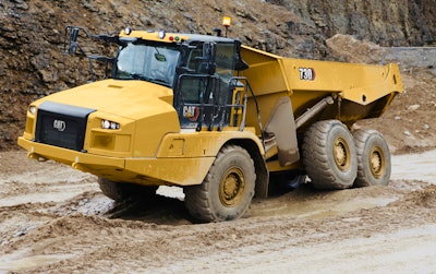 Cat 730 articulated dump truck muddy terrain