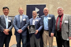 Hyundai Construction Equipment Americas leadership give award to National Equipment Dealers