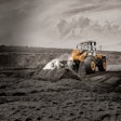 LiuGong 856H wheel loader scooping dirt on a construction site.