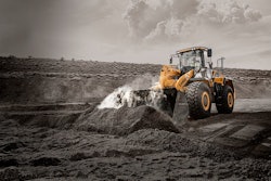 LiuGong 856H wheel loader scooping dirt on a construction site.