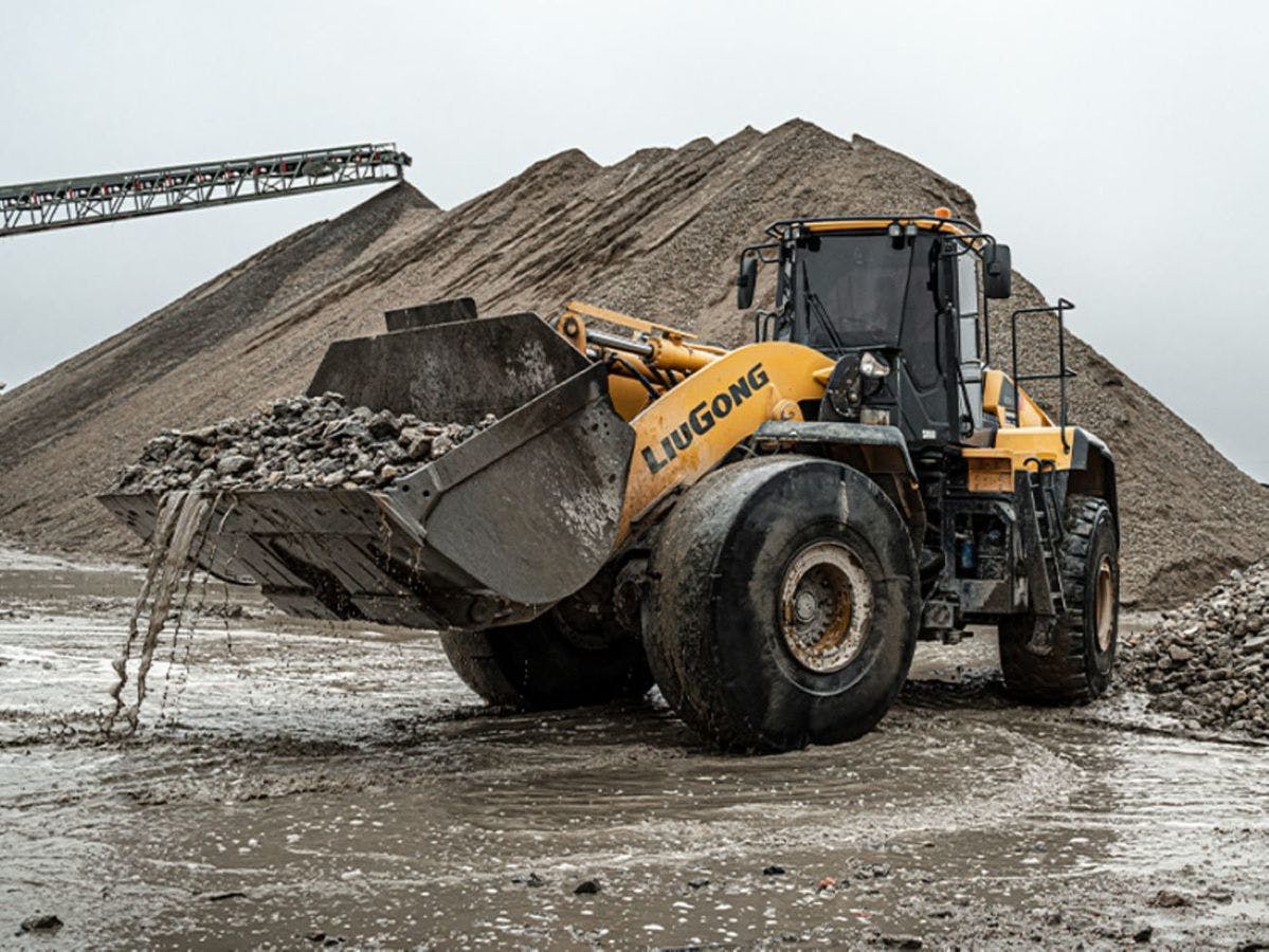 LiuGong 890H wheel loader with bucket full of rocks at a quarry.