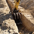 Excavator being used to dig a trench