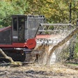 Fecon forestry mulcher cutting down a tree