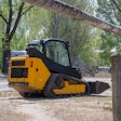 Compact track loader at a jobsite.