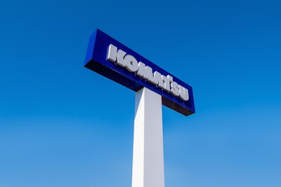 Komatsu sign with new branding.