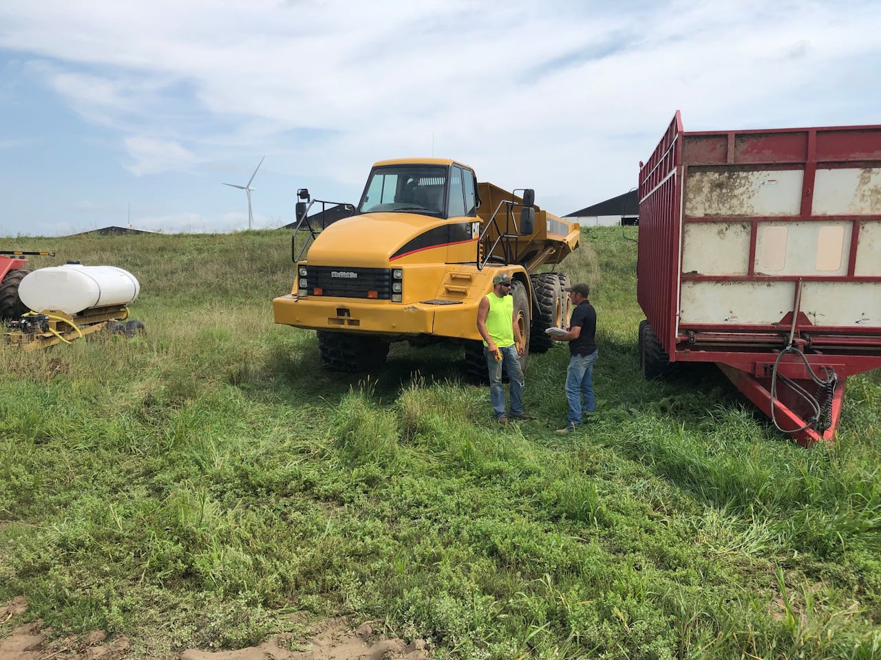 Jason Guelig talks with dump truck driver