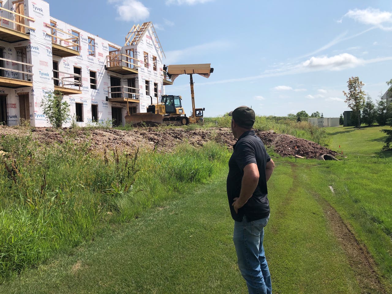 Jason Guelig on multifamily housing construction site