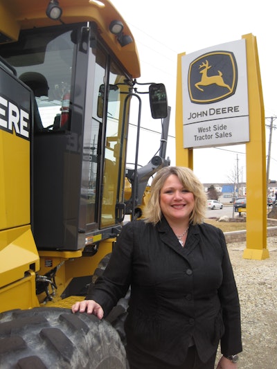 Diane Benck standing outside of West Side Tractor Sales.
