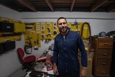 Mechanic standing in a parts room