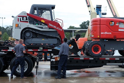Takeuchi CTL and Skyjack lift on a trailer at H&E Equipment Services in Fairburn, GA.