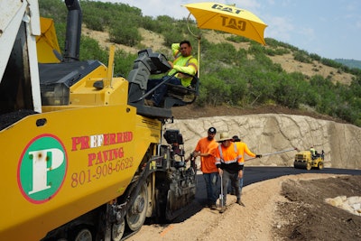 Preferred Paving employees paving an asphalt road