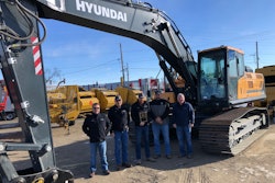 West River Equipment management team stands in front of Hyundai excavator