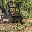 Bobcat loader drum mulched clearing brush.