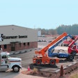 H&E Equipment Services yard with telehandlers parked outside