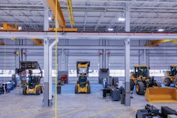 West Side Tractor shop with heavy and compact construction equipment in need of maintenance.