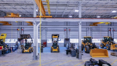 West Side Tractor shop with heavy and compact construction equipment in need of maintenance.