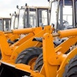 Wheel loaders parked in a row