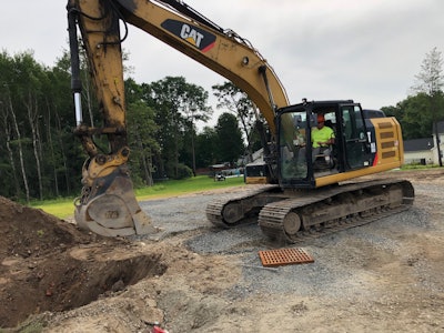 matt senter operating a CAT excavator