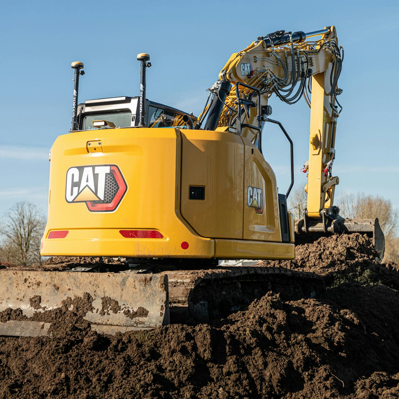 Cat excavator digging a trench