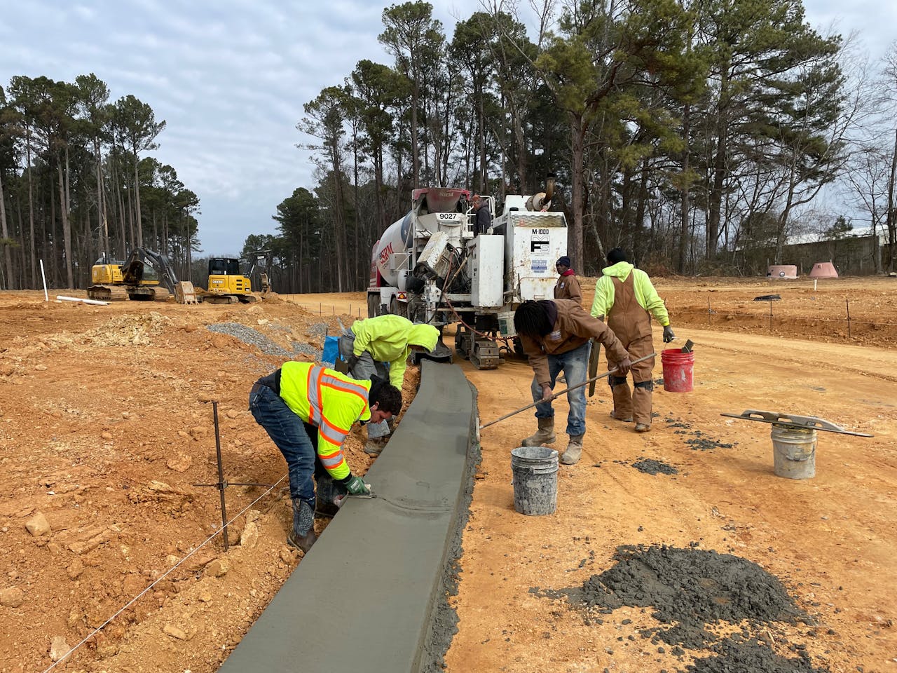 H.W. Tucker concrete crew installing curbs in a new subdivision.
