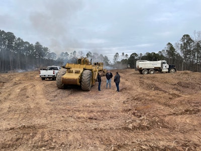 H.W. Tucker uses a scraper, excavators and a water truck at a jobsite.