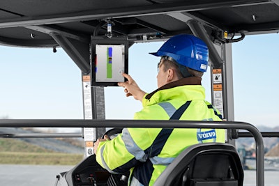 Volvo Compact Assist Asphalt Compactor operator points to monitor