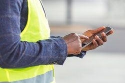 Worker using cell phone