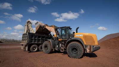 CASE 1121G wheel loader dumping