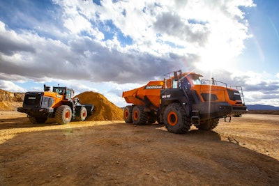 Doosan wheel loader loading material into a haul truck