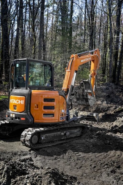 Hitachi Z50U-5N compact excavator digging mud