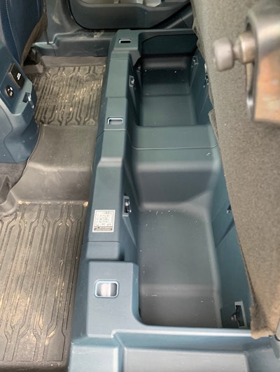 More storage under the rear seat. Notice dual USB charge ports and conventional 12-volt round plug to keep devices juiced up.