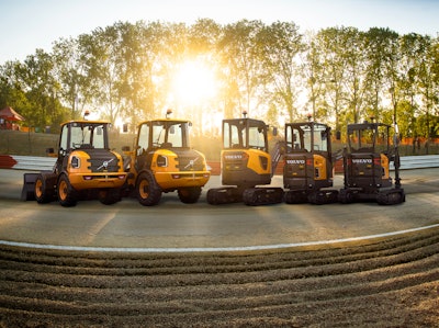 Volvo Electric Compact Wheel Loaders and Excavators parked outside